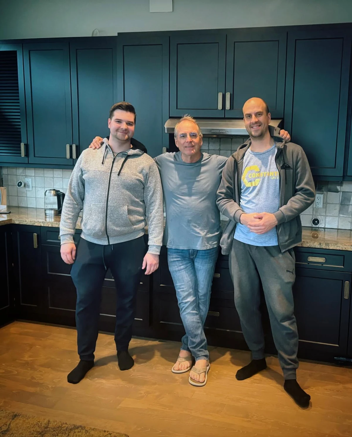Konstantin with client Michael and another person in their completed kitchen